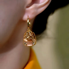 Close-up detail of the sparkling zircons and plating on the Square Tassel Earrings