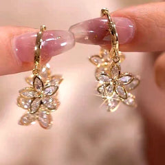 Angled view of the 14K Gold-Plated Luxury Zircon Flower Tassel Earrings