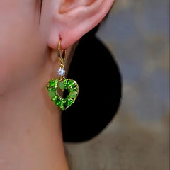 Close-up detail of the sparkling zircons and plating on the Cat's Eye Heart Earrings