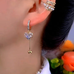 Model showcasing the dangle and style of the 14K Gold-Plated Luxury Zircon Heart Earrings