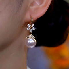 Close-up detail of the sparkling zircons and plating on the Zircon Pearl Earrings