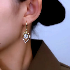 Close-up detail of the sparkling zircons and plating on the Star Heart Earrings