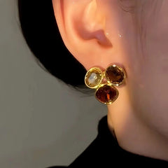 Model showcasing the dangle and style of the 14K Gold-Plated Luxury Zircon Stud Earrings