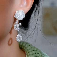 Close-up detail of the sparkling zircons and plating on the Rose Tassel Earrings