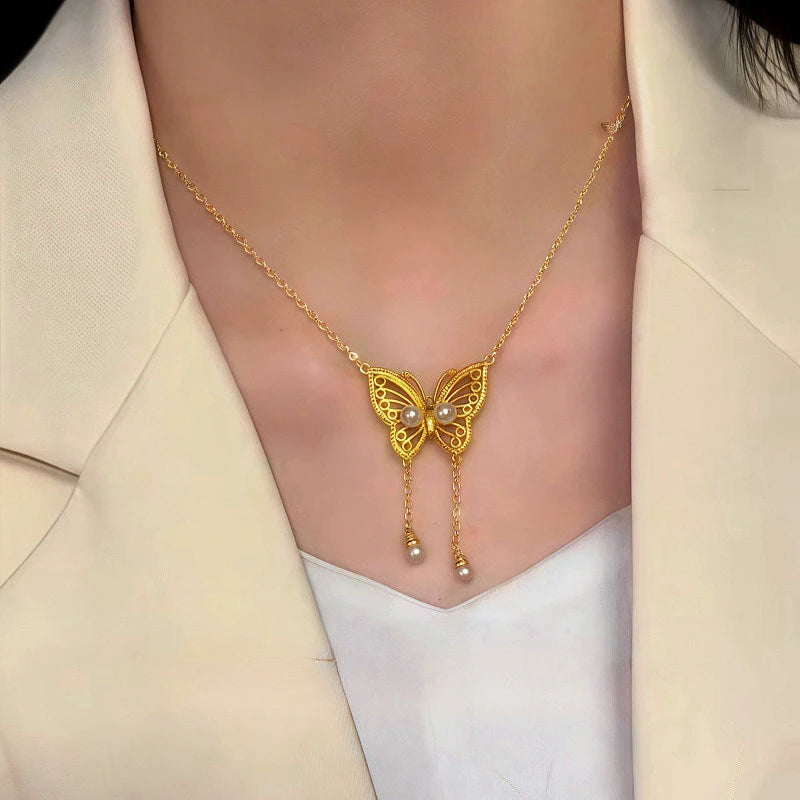 Detailed view of the 14K Gold-Plated Magnetic Pearl Hollow Butterfly Necklace chain and pendant