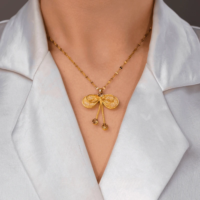 Close-up of the pendant and clasp on the Butterfly Bow Necklace