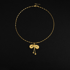 Detailed view of the 14K Gold-Plated Mesh Butterfly Bow Pendant Necklace chain and pendant