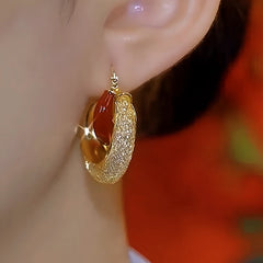 Model showcasing the dangle and style of the 14K Gold-Plated Mesh Crystal Earrings