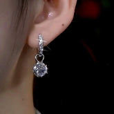 Sparkling Silver Crystal Dangle Huggie Hoop Earring on Woman's Ear