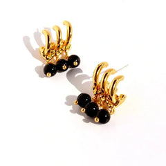 Close-up detail of the sparkling zircons and plating on the Black Bead Tassel