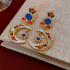 Model showcasing the dangle and style of the 14K Gold-Plated Oil-Drop Diamond Moon Star Flower Pearl Earrings