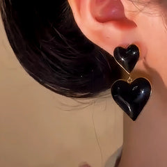 Close-up detail of the sparkling zircons and plating on the Double-Heart Earrings