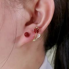 Close Up of Red Rose Red Bead Gold Dangle Stud Earrings on Ear