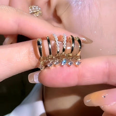 3 pairs gold pearl CZ drop huggie hoop earrings and ear cuff set in hand
