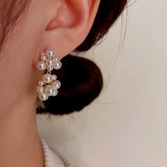 Close-up detail of the sparkling zircons and plating on the Pearl Earrings