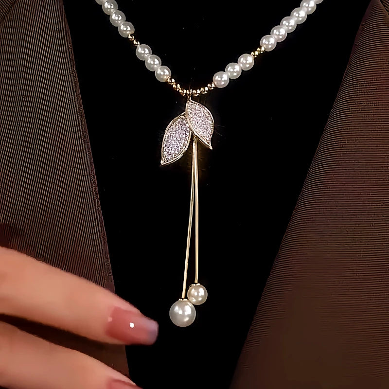 Close-up of the pendant and clasp on the Pearl Leaf Necklace