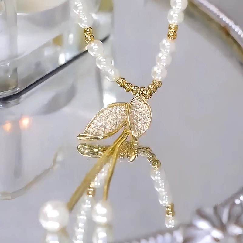 14K Gold-Plated Pearl Leaf Sweater Necklace worn to showcase its length and pendant detail