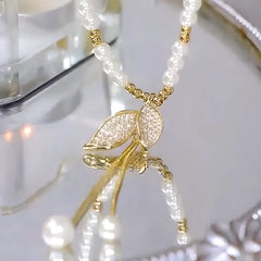 14K Gold-Plated Pearl Leaf Sweater Necklace worn to showcase its length and pendant detail