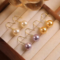 Close-up detail of the sparkling zircons and plating on the Pearl Pendant Earrings