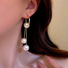 Close-up detail of the sparkling zircons and plating on the Pearl Tassel Earrings