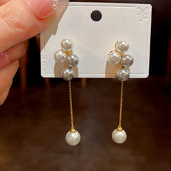 Close-up detail of the sparkling zircons and plating on the Pearl Tassel Earrings