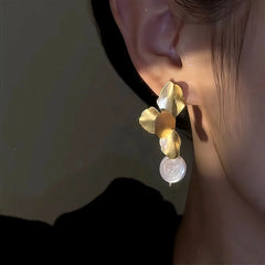 Close-up detail of the sparkling zircons and plating on the Petal Flower Earrings