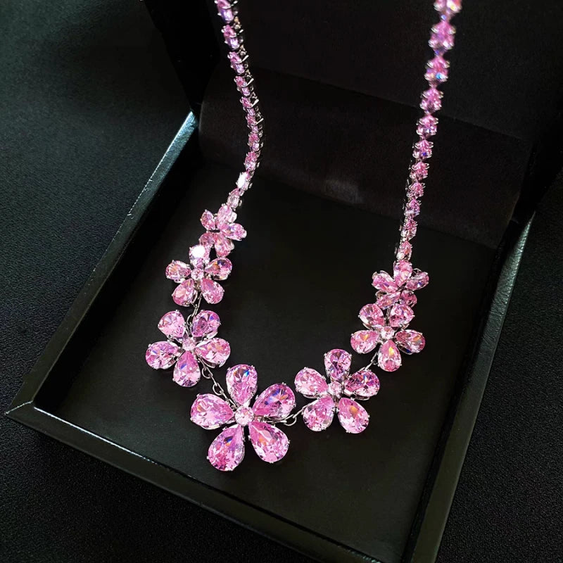 Detailed view of the 14K Gold-Plated Pink Zircon Diamond Flower Necklace And Earrings Set chain and pendant