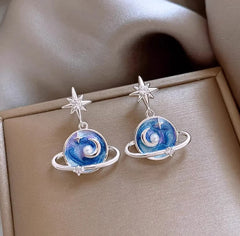 Pair of Celestial Silver Blue Planet Star Dangle Earrings in Jewelry Box
