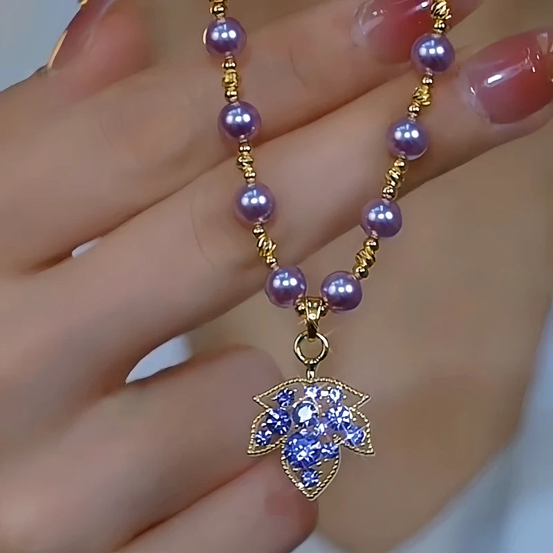 14K Gold-Plated Purple Diamond Maple Leaf Pearl Necklace worn to showcase its length and pendant detail