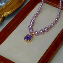 Detailed view of the 14K Gold-Plated Purple Diamond Pearl Necklace chain and pendant