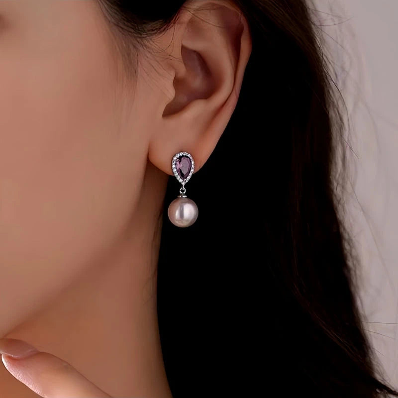 Teardrop Purple Gem Halo Pearl Drop Earring on Woman's Ear