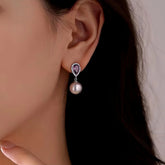 Teardrop Purple Gem Halo Pearl Drop Earring on Woman's Ear