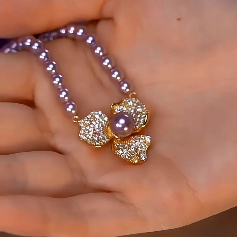 Detailed view of the 14K Gold-Plated Purple Pearl Flower Necklace chain and pendant