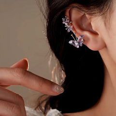 Purple butterfly crystal ear climber earring styled on a woman's ear