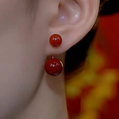 Close-up detail of the sparkling zircons and plating on the Red Bead Earrings