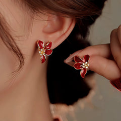 Close-up detail of the sparkling zircons and plating on the Red Glaze Flower Earrings