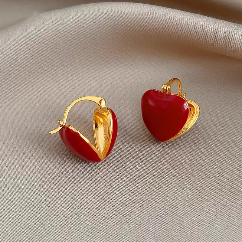 Angled view of the 14K Gold-Plated Red Heart Earrings