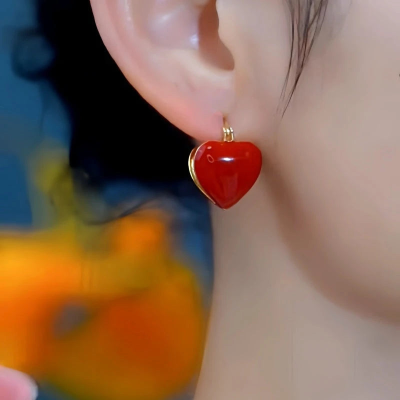 Close-up detail of the sparkling zircons and plating on the Red Heart Earrings