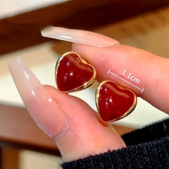 Angled view of the 14K Gold-Plated Red Heart Hoop Earrings