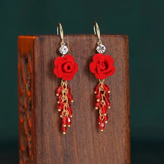 Angled view of the 14K Gold-Plated Red Rose Tassel Ear Hooks