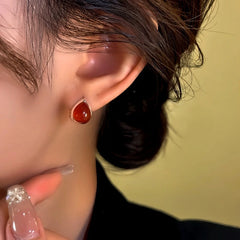 Close-up detail of the sparkling zircons and plating on the Red Teardrop Hoops