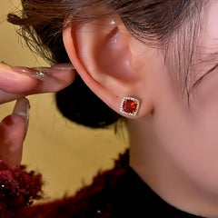 Close-up detail of the sparkling zircons and plating on the Red Zircon Studs