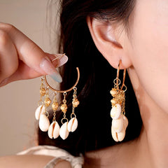 Close-up detail of the sparkling zircons and plating on the Shell Tassel Earrings