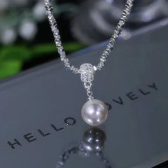 Detailed view of the 14K Gold-Plated Silver Pearl Earrings chain and pendant