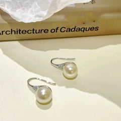 Angled view of the 14K Gold-Plated Simple And Versatile Pearl Earrings