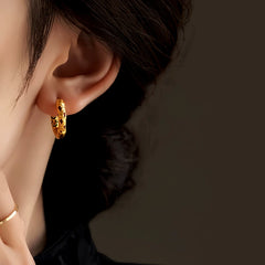 Close-up detail of the sparkling zircons and plating on the Small Gold Hoops