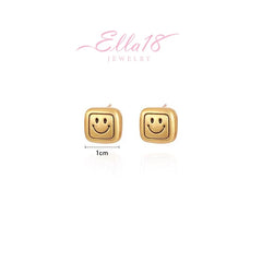 Angled view of the 14K Gold-Plated Smiley Face Stud Earrings
