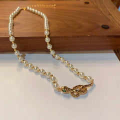 14K Gold-Plated Snake Pearl Necklace worn to showcase its length and pendant detail