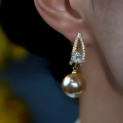 Close-up detail of the sparkling zircons and plating on the Champagne Pearl Earrings