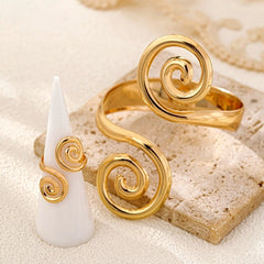 Model wearing the 14K Gold-Plated Spiral Cloud Bracelet And Ring Set to highlight its design on the wrist